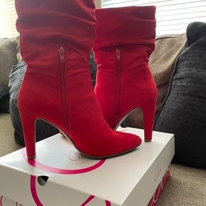 Red high heel boots.